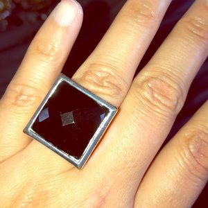 Costume jewelry ring. With black stone.